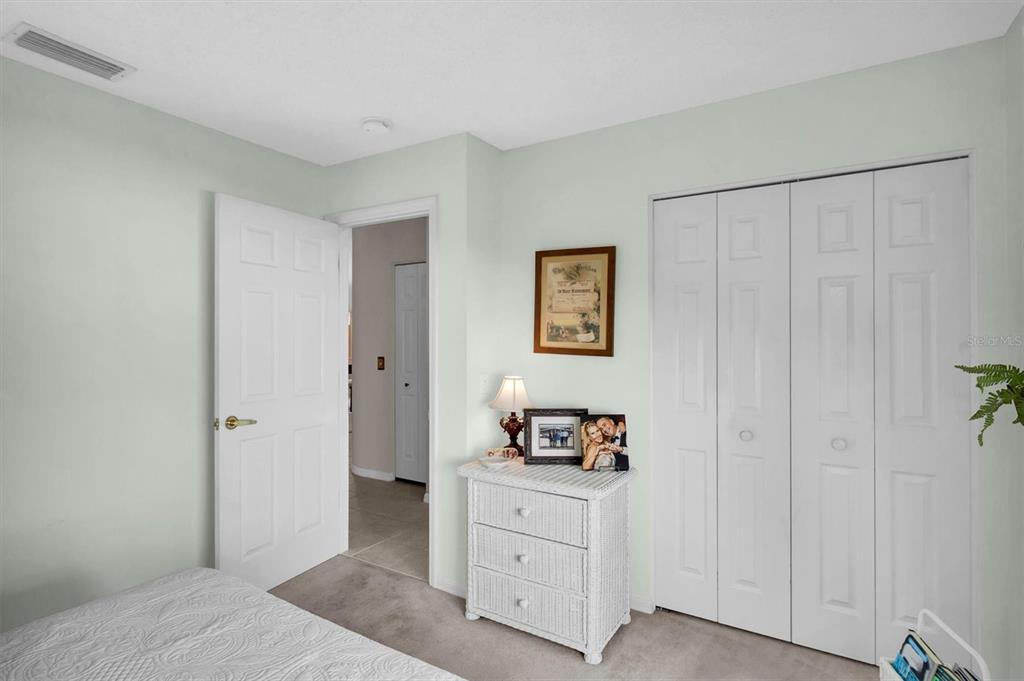 11634 Wheatfield Loop Hudson, FL 34667 - Photo 21 of 38 a bedroom with a bed and a window