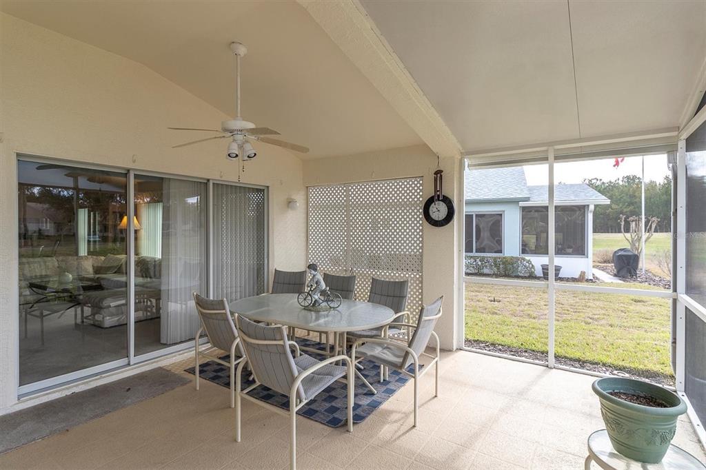 11634 Wheatfield Loop Hudson, FL 34667 - Photo 26 of 38 a dining room with furniture and large windows