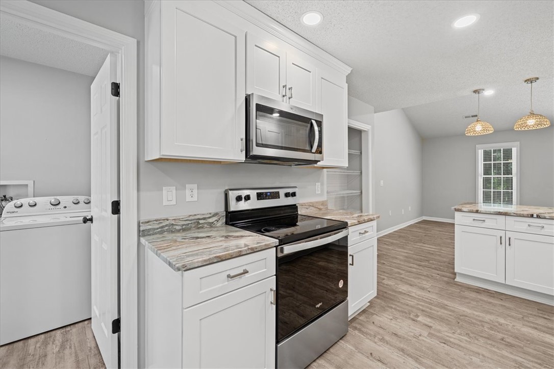 212 Blue Ridge Drive Clemson, SC 29631 - Photo 10 of 33 Culinary aspirations come to life in this spacious kitchen, boasting premium appliances and ample counter space.