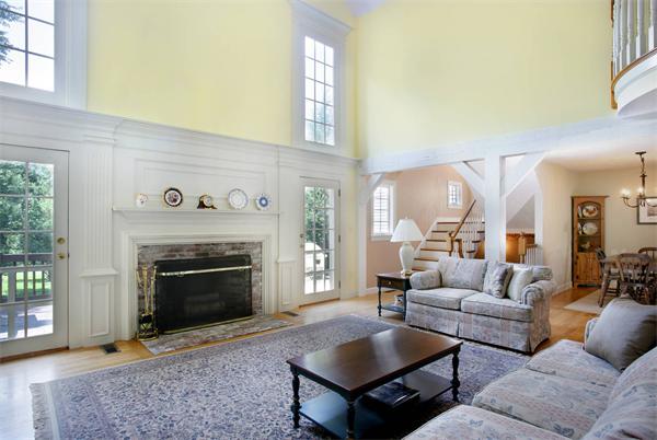 11 Brookmill Road Stow, MA 01775 - Photo 5 of 8 a living room with furniture and a fireplace