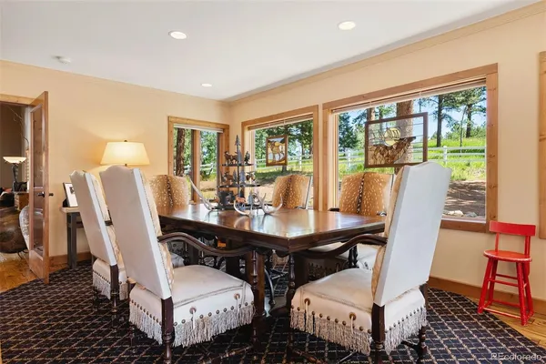 a view of a dining room with furniture window and outside view