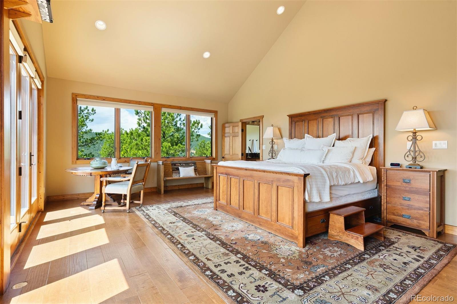 12351 South Ridge Road Conifer, CO 80433 - Photo 25 of 50 a bedroom with furniture and a large window