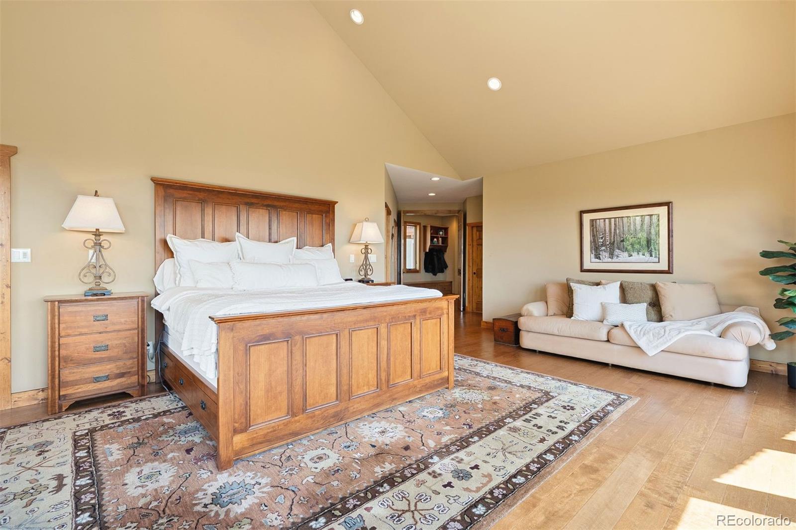 12351 South Ridge Road Conifer, CO 80433 - Photo 26 of 50 a bedroom with furniture and a dresser