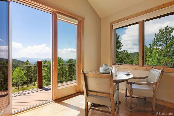 a view of a room with a furniture and balcony