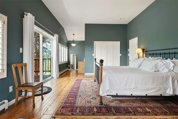 a living room with furniture rug and wooden floor