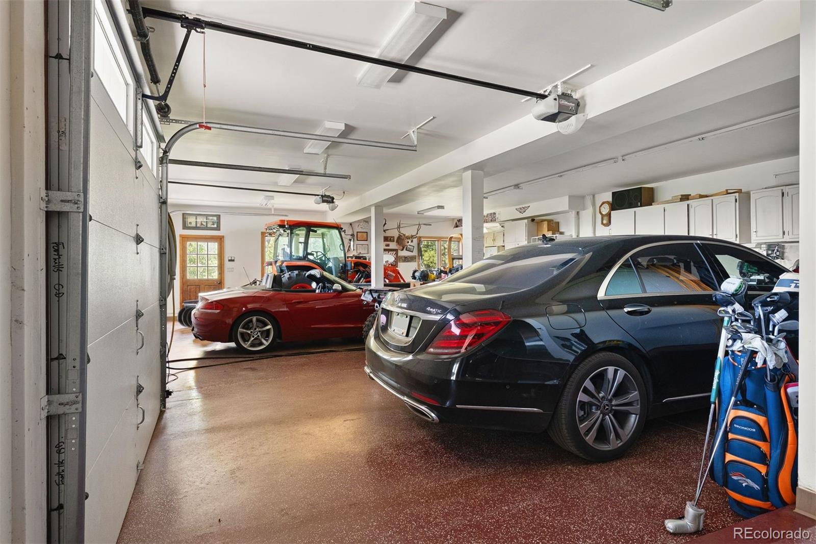 12351 South Ridge Road Conifer, CO 80433 - Photo 40 of 50 a car parked in the garage