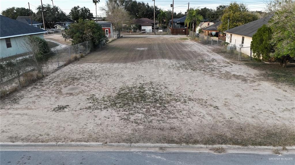2018 Puerto Rico Avenue Weslaco, TX 78596 - Photo 9 of 17 a view of a yard with a car parked on the road