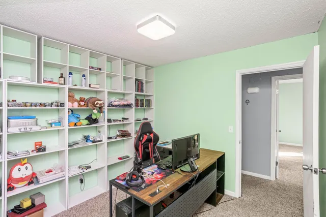 a view of a workspace with furniture