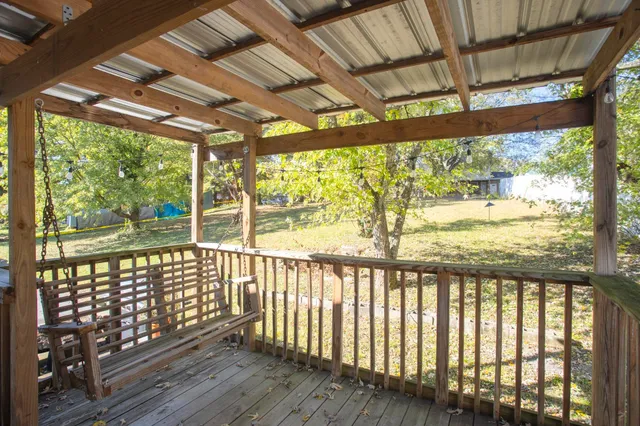a view of porch with wooden floor