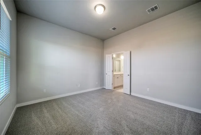a view of kitchen and refrigerator