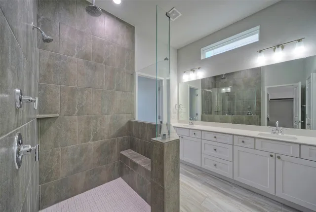 a bathroom with a double vanity sink and mirror