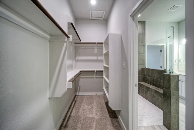 a bathroom with a double vanity sink and mirror