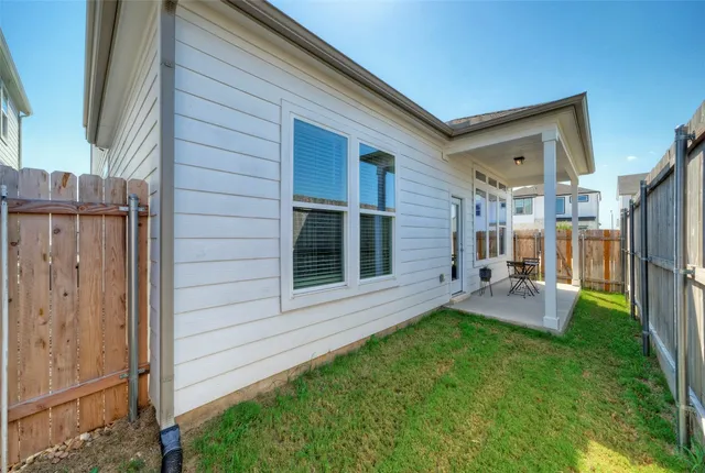 a backyard of a house with seating space