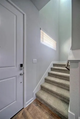 a view of staircase with white walls