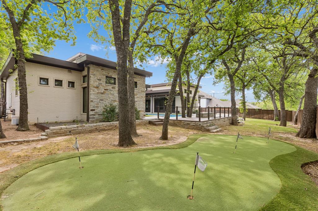548 Oak Grove Lane Coppell, TX 75019 - Photo 34 of 36 a swimming pool with outdoor seating and yard