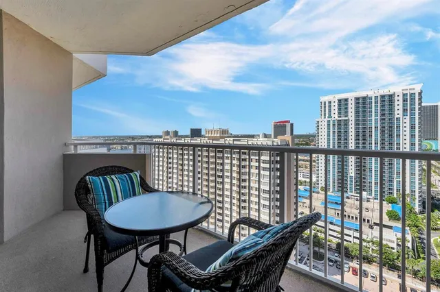 a view of a balcony with furniture