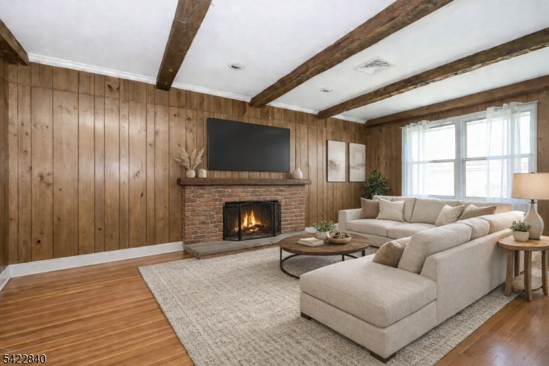 2142 South Branch Road Neshanic Station, NJ 08853 - Photo 11 of 48 a living room with furniture a fireplace and a flat screen tv