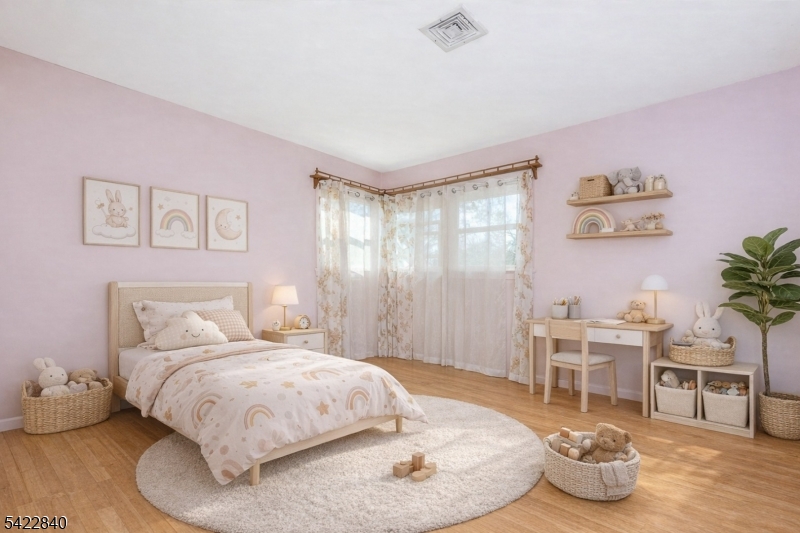2142 South Branch Road Neshanic Station, NJ 08853 - Photo 19 of 48 a bedroom with a bed and a chandelier