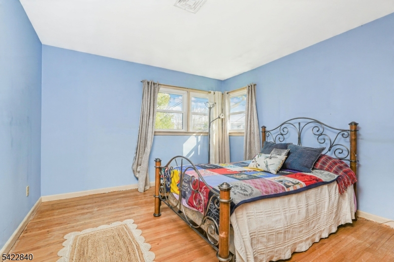 2142 South Branch Road Neshanic Station, NJ 08853 - Photo 20 of 48 a bedroom with a bed and window