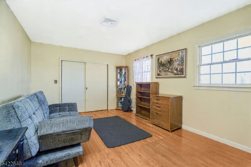 2142 South Branch Road Neshanic Station, NJ 08853 - Photo 21 of 48 a living room with furniture and wooden floor