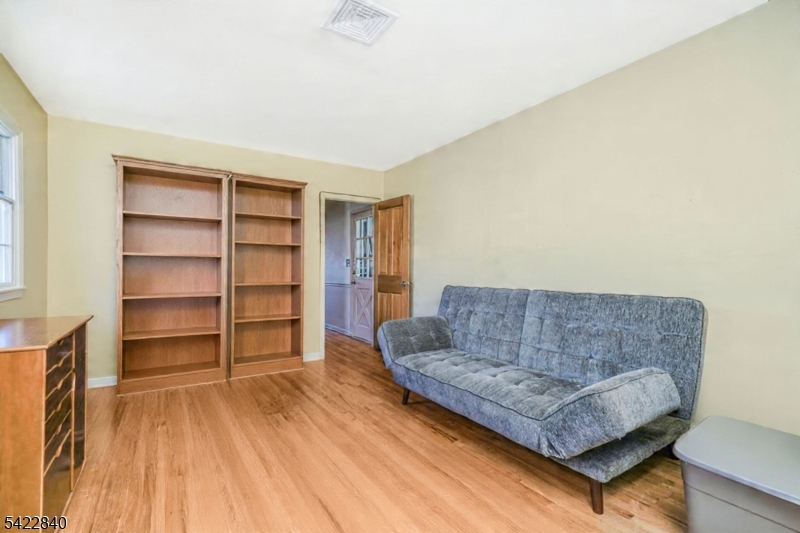 2142 South Branch Road Neshanic Station, NJ 08853 - Photo 22 of 48 a living room with furniture and a book shelf
