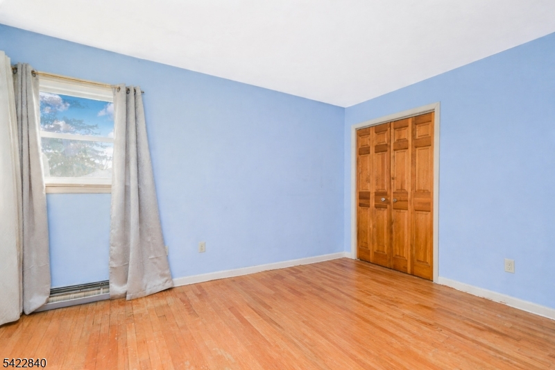2142 South Branch Road Neshanic Station, NJ 08853 - Photo 36 of 48 a view of an empty room with wooden floor