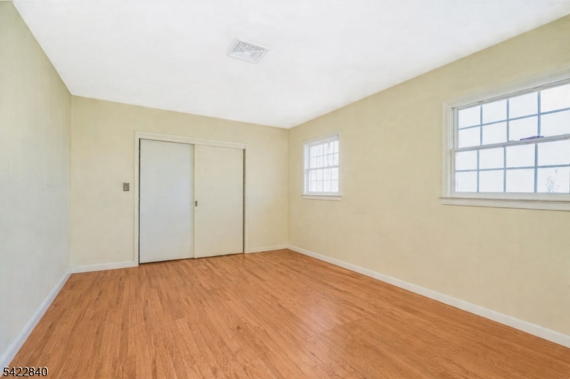 2142 South Branch Road Neshanic Station, NJ 08853 - Photo 41 of 48 a view of empty room with wooden floor and fan