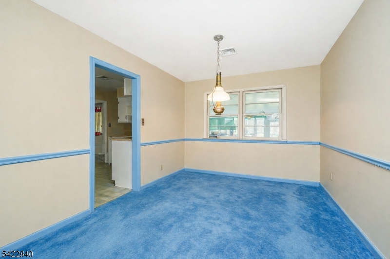2142 South Branch Road Neshanic Station, NJ 08853 - Photo 42 of 48 a view of empty room with wooden floor and fan