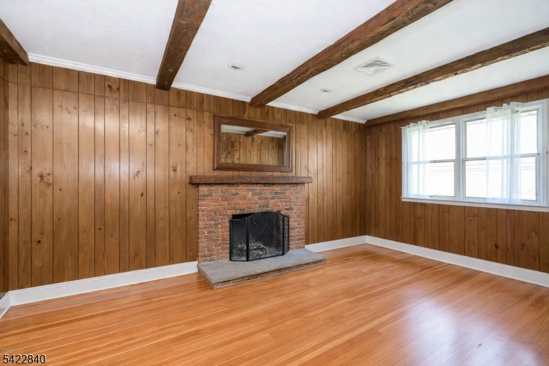 2142 South Branch Road Neshanic Station, NJ 08853 - Photo 44 of 48 a view of an empty room with wooden floor and a window