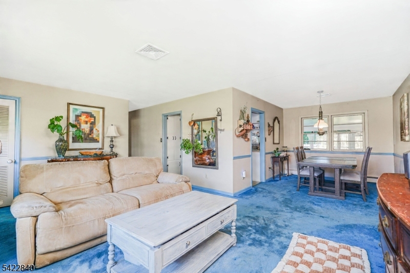 2142 South Branch Road Neshanic Station, NJ 08853 - Photo 6 of 48 a living room with furniture and a dining table