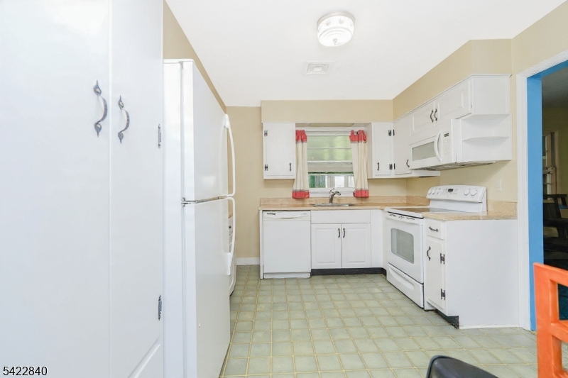 2142 South Branch Road Neshanic Station, NJ 08853 - Photo 8 of 48 a kitchen with cabinets and window