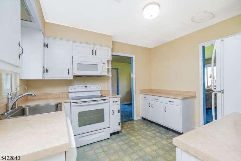 2142 South Branch Road Neshanic Station, NJ 08853 - Photo 9 of 48 a kitchen with cabinets appliances and a sink