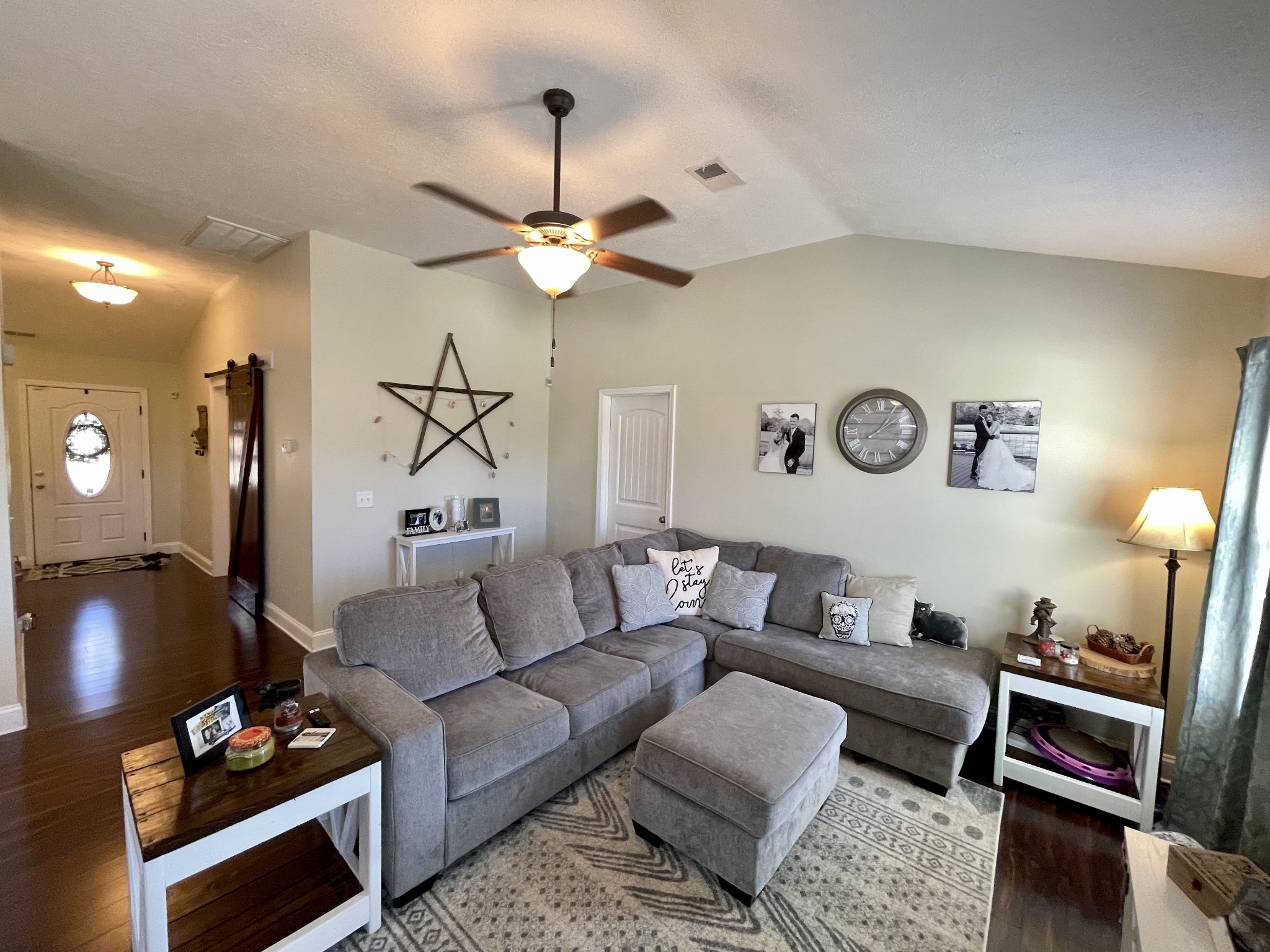 339 Golfview Lane Springfield, TN 37172 - Photo 16 of 34 a living room with furniture a rug and a chandelier