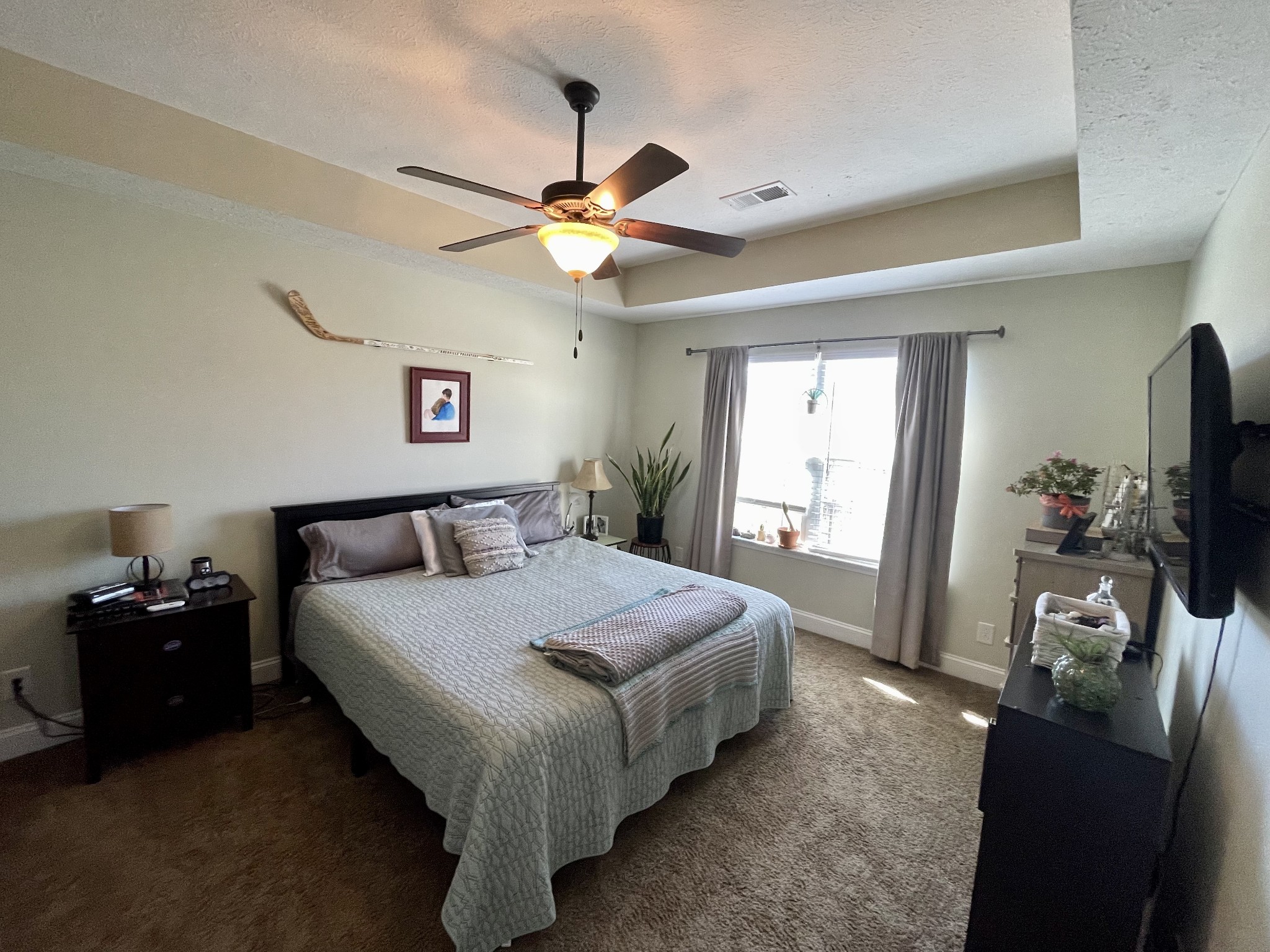 339 Golfview Lane Springfield, TN 37172 - Photo 21 of 34 a bedroom with a bed and a flat tv screen on dresser