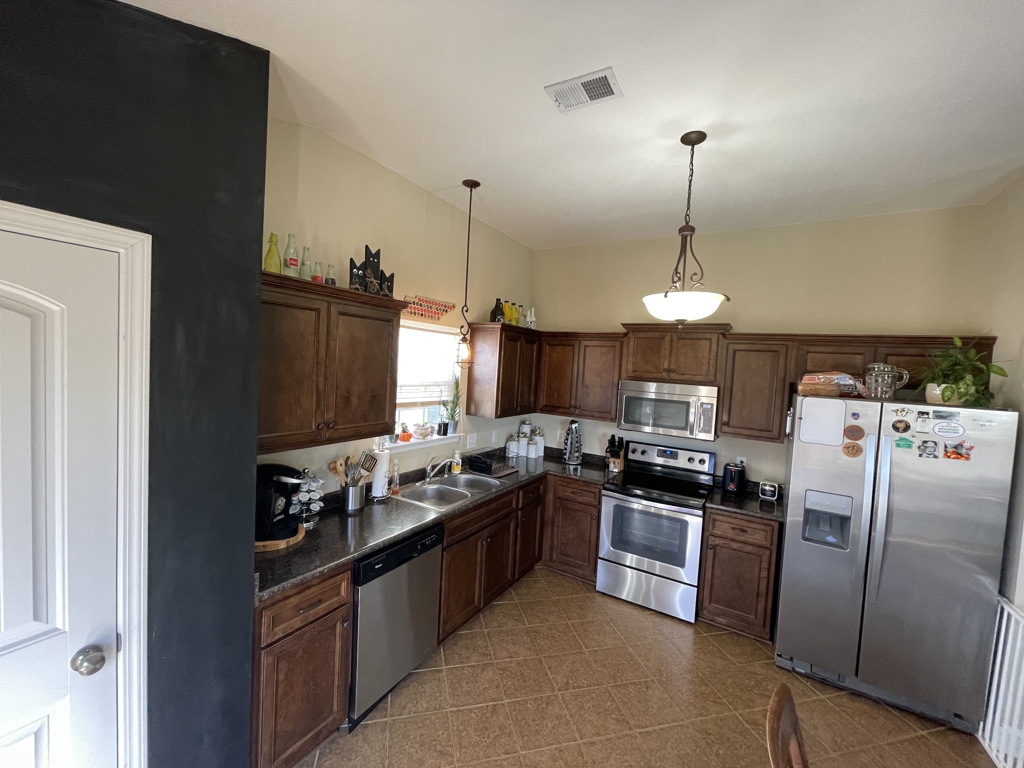339 Golfview Lane Springfield, TN 37172 - Photo 9 of 34 a kitchen with stainless steel appliances granite countertop a sink a stove and refrigerator