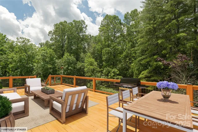 a view of a balcony with trees