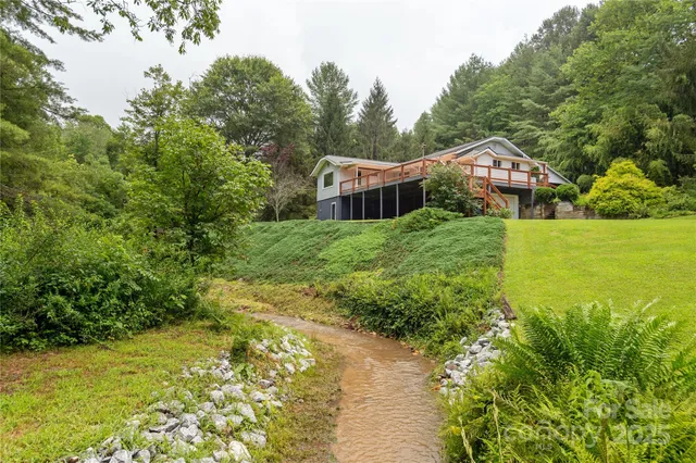 a view of a yard with a tree