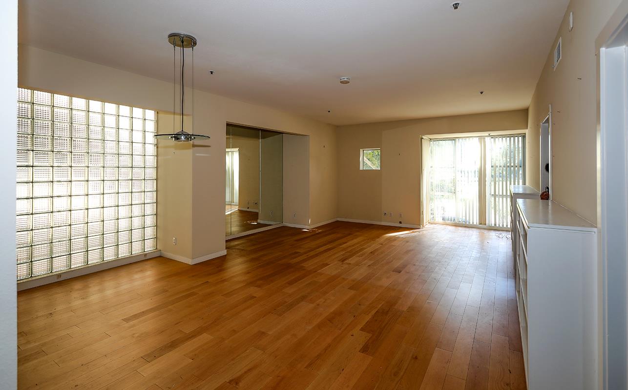 97 East St James Street, Unit 21 San Jose, CA 95112 - Photo 11 of 22 a view of empty room with wooden floor and window