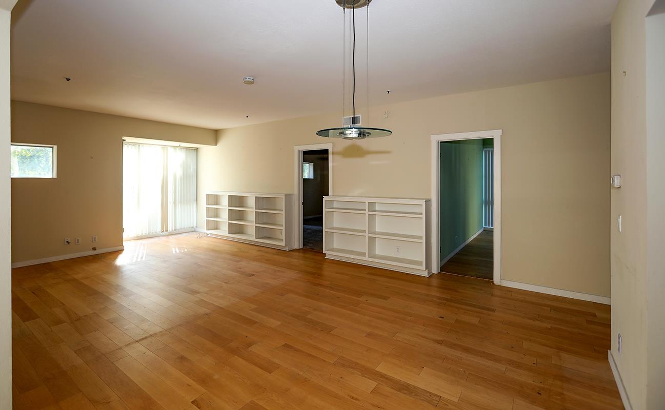 97 East St James Street, Unit 21 San Jose, CA 95112 - Photo 12 of 22 a view of empty room with wooden floor and fan