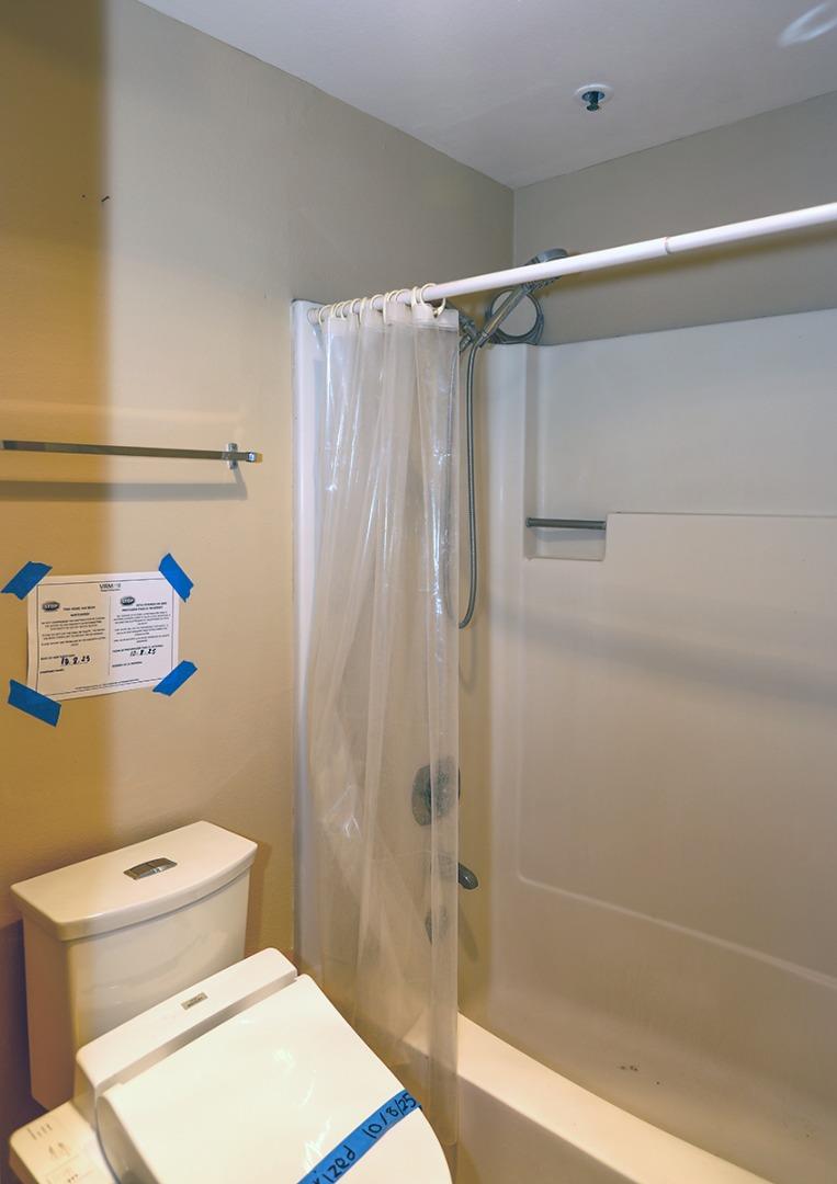 97 East St James Street, Unit 21 San Jose, CA 95112 - Photo 17 of 22 a bathroom with a toilet and a shower