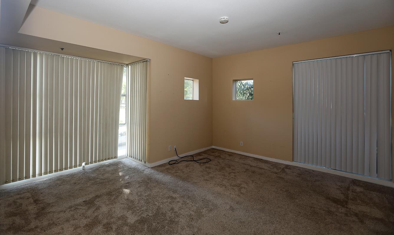 97 East St James Street, Unit 21 San Jose, CA 95112 - Photo 19 of 22 a view of an empty room with a window