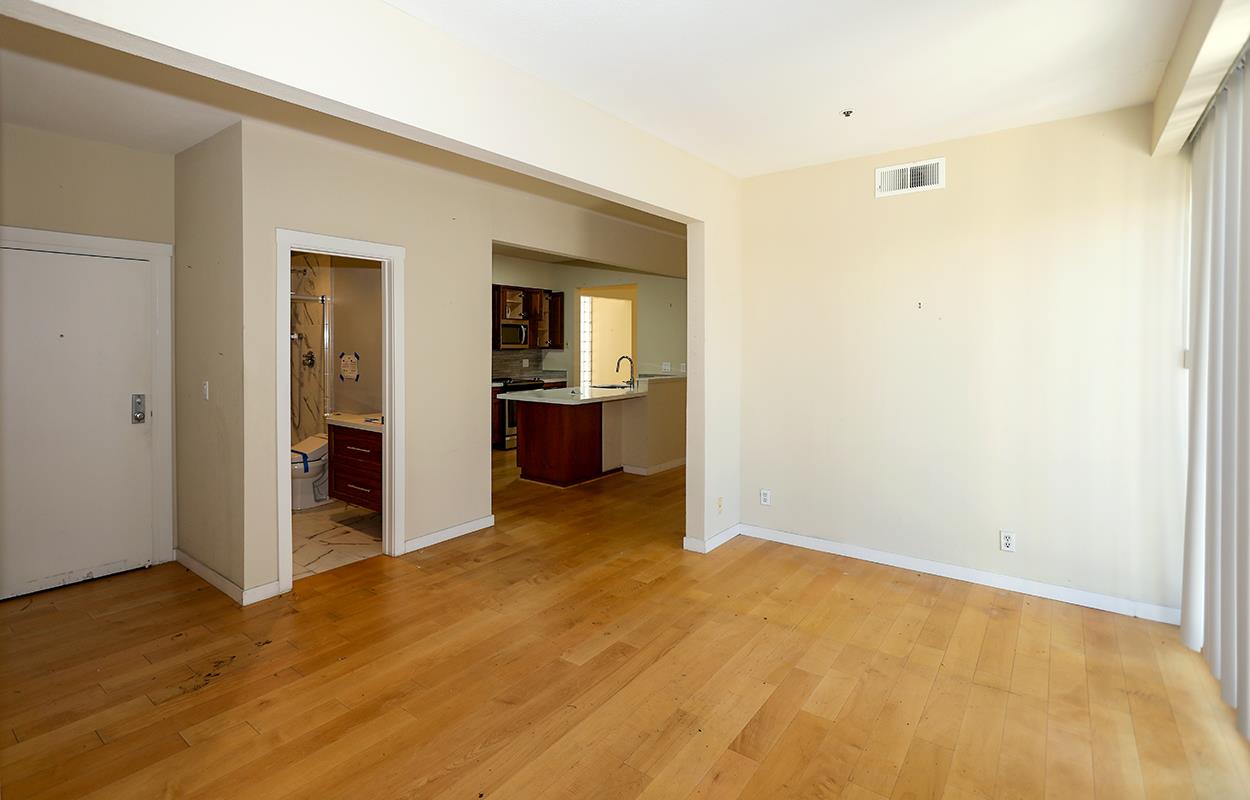 97 East St James Street, Unit 21 San Jose, CA 95112 - Photo 7 of 22 a view of empty room with wooden floor