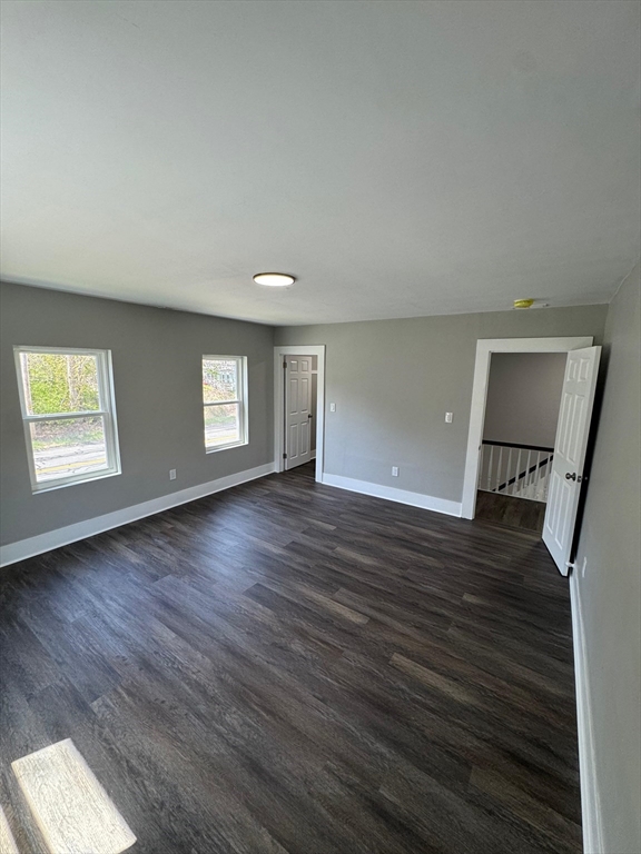 32 Main Street Monson, MA 01057 - Photo 33 of 42 an empty room with wooden floor and windows