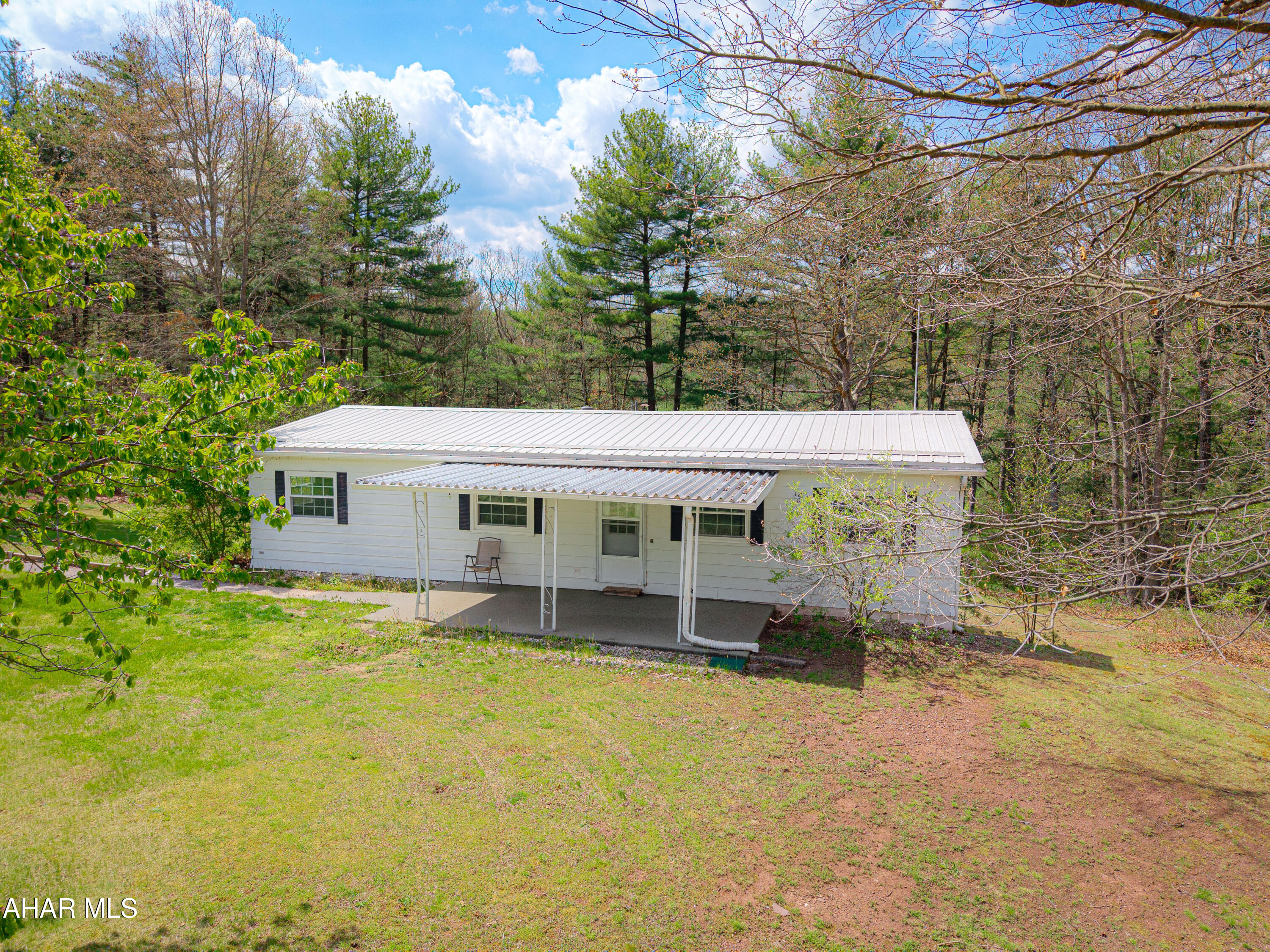 151 Pine Echo Road Everett, PA 15537 - Photo 4 of 51 a view of a house with a yard