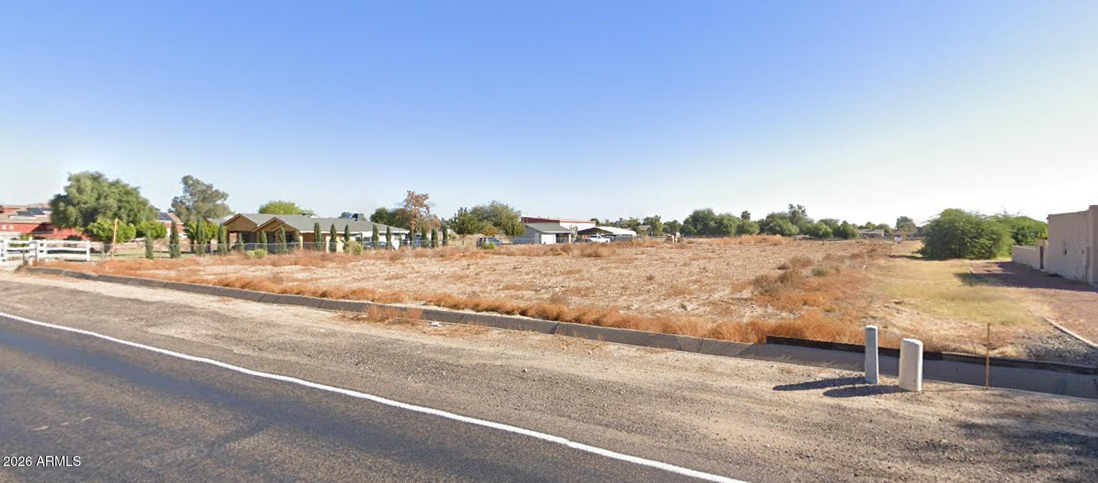 a view of a road and yard