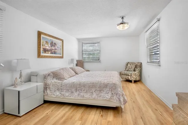 a bedroom with a bed and a couch