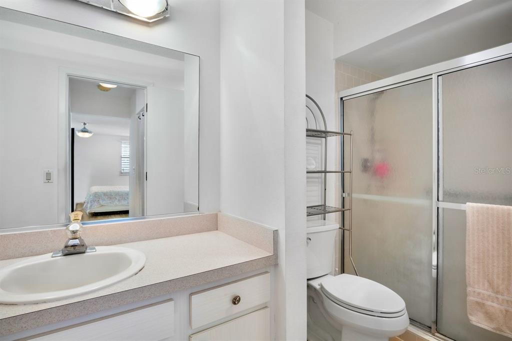5150 Marsh Field Lane, Unit 120 Sarasota, FL 34235 - Photo 13 of 21 a bathroom with a sink toilet and shower