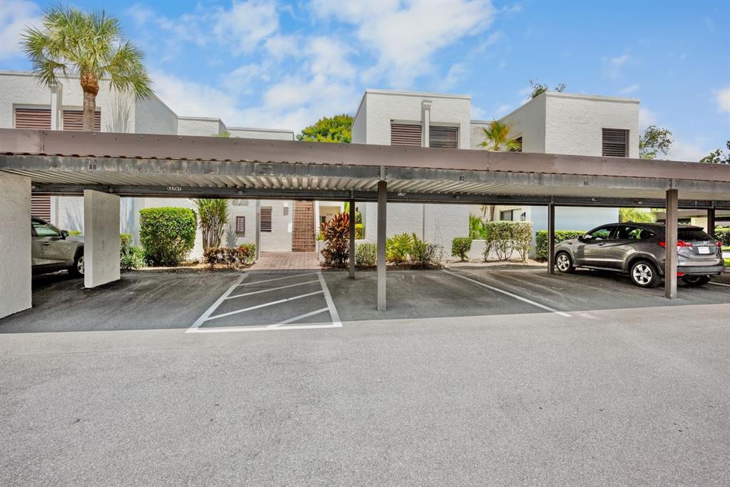5150 Marsh Field Lane, Unit 120 Sarasota, FL 34235 - Photo 4 of 21 a view of building with car parked