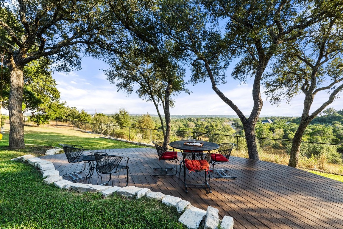 14400 Echo Bluff Austin, TX 78737 - Photo 1 of 40 a view of a swimming pool with a patio and a yard