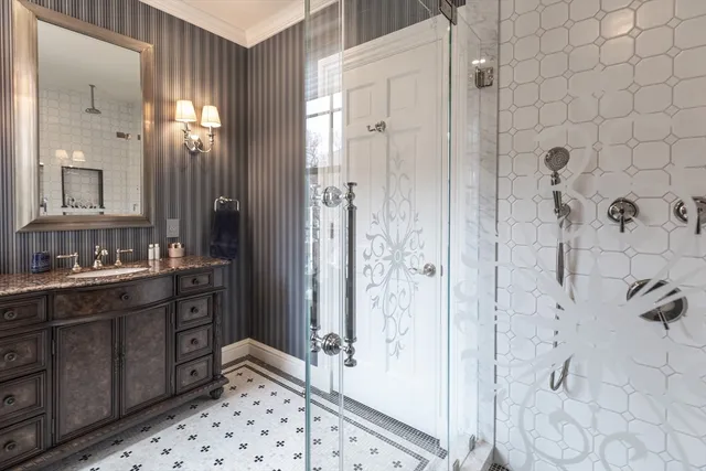 a spacious bedroom with a bed a fireplace and a window